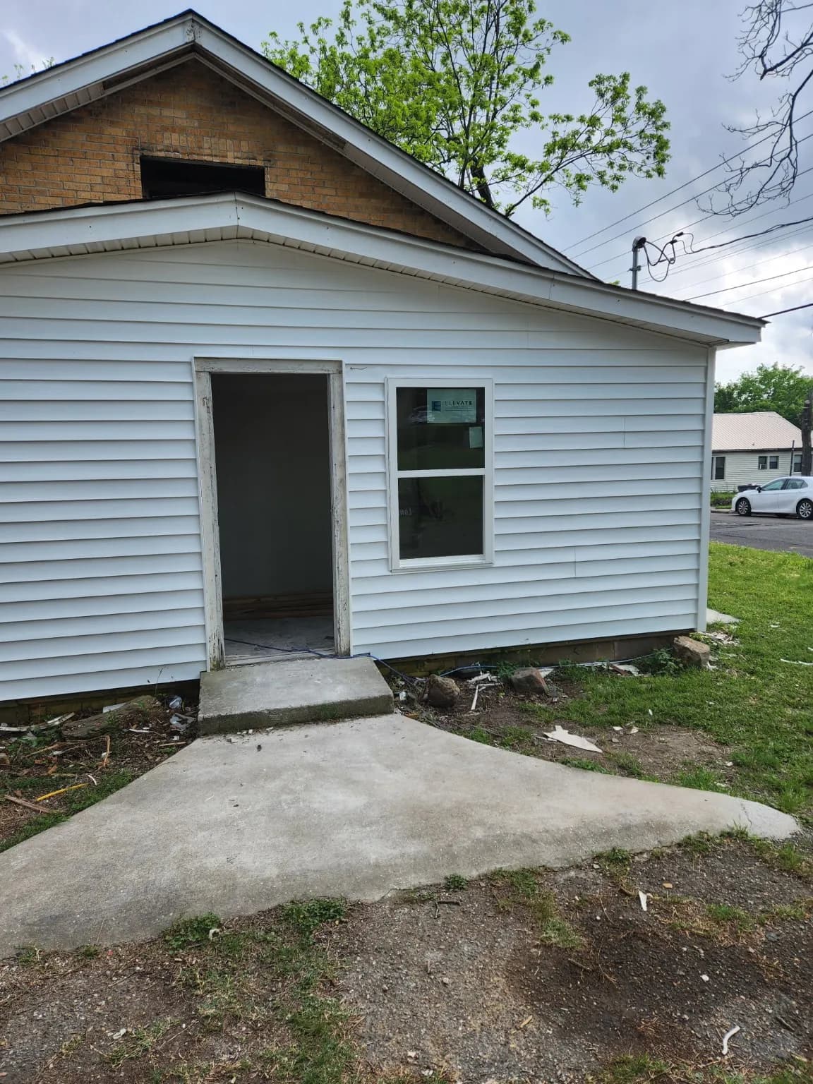Exterior addition with new siding and windows