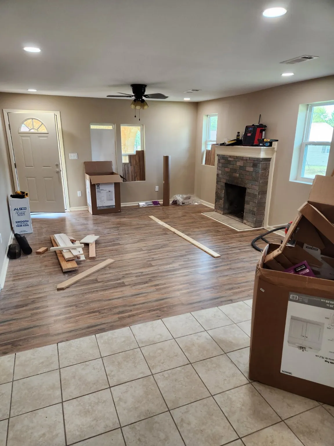Interior renovation with new flooring and recessed lighting